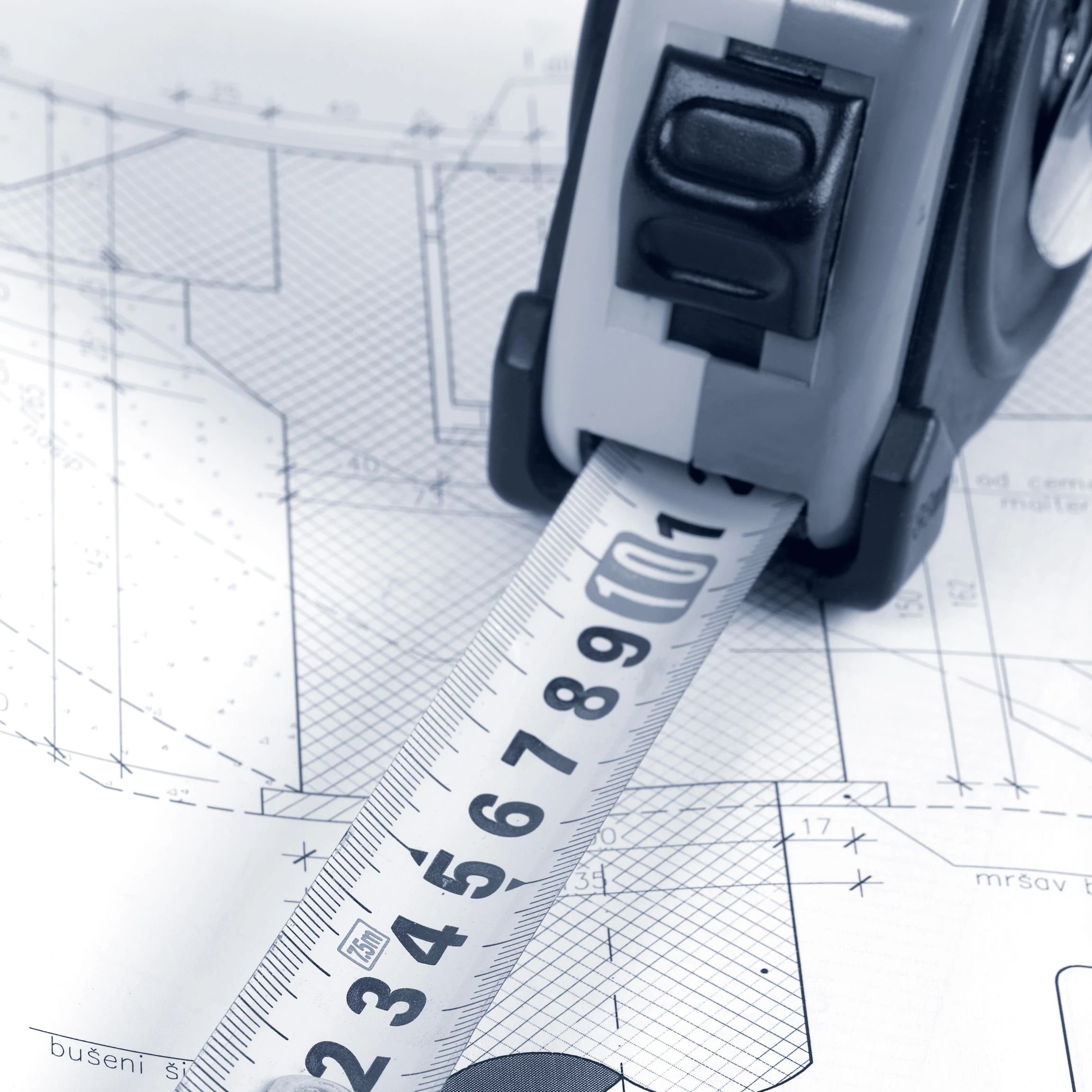 measuring tape on blueprints