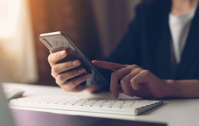 person holding smartphone in hand